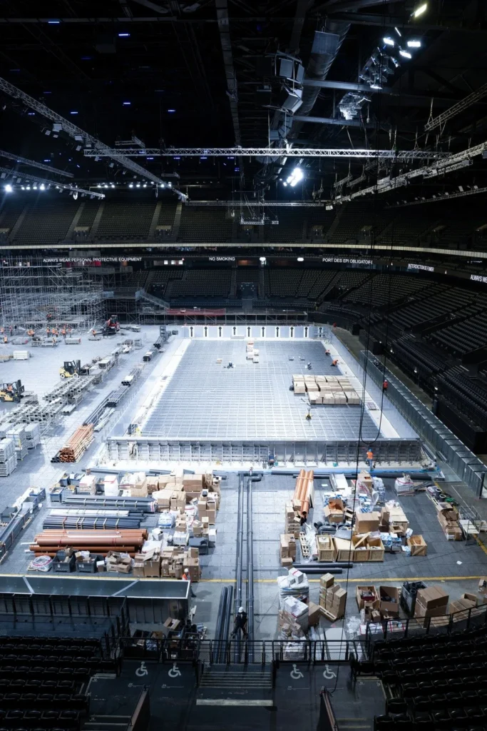 Stainless steel pool being assembled inside an arena