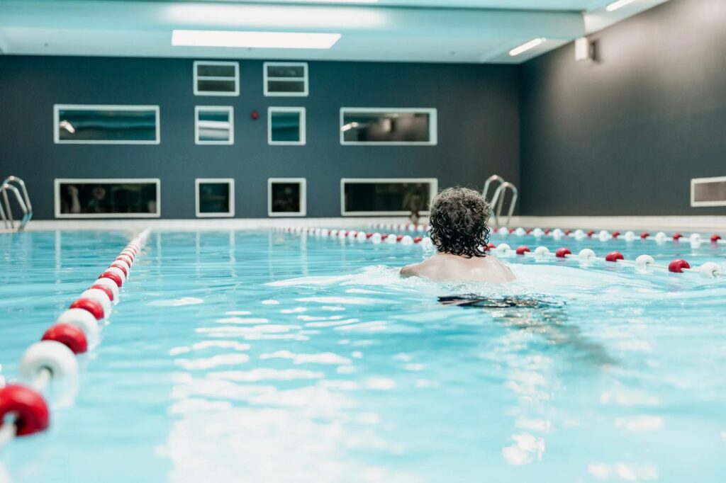 Swimmer in a lane of the public pool at Plaza Sportiva, Groningen
